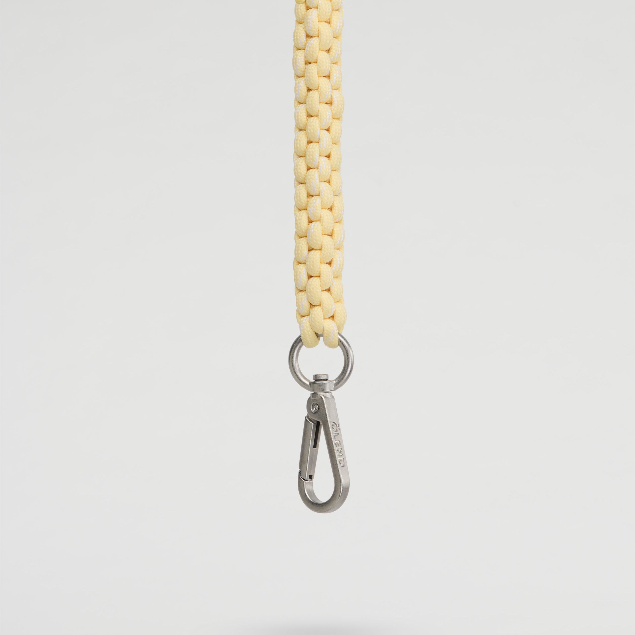 Olend Climbing Keychain in butter yellow — woven paracord keychain with silver carabiner clip, lightweight bag charm for keys